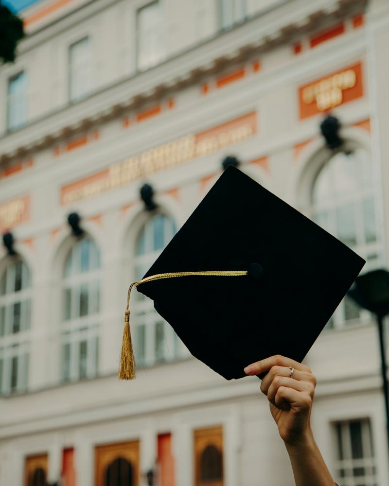 Graduate holding a cap at the convocation ceremony