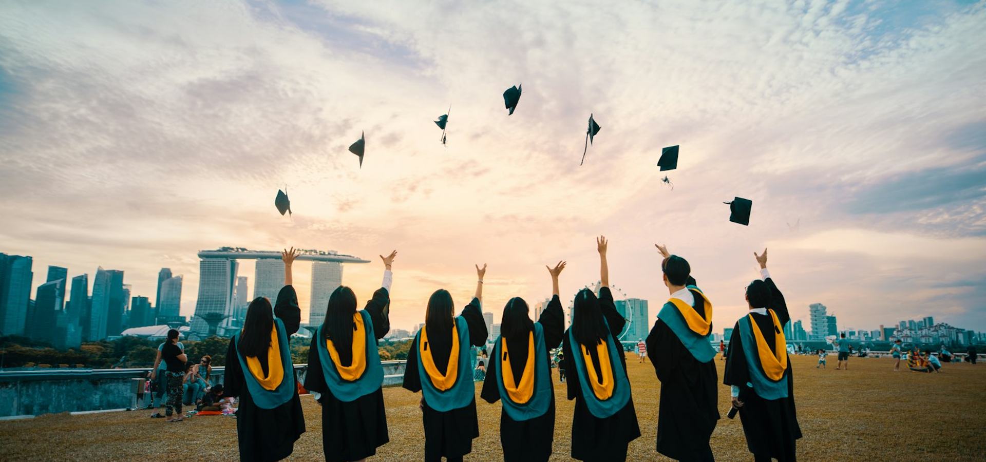 Graduates tossing caps at convocation