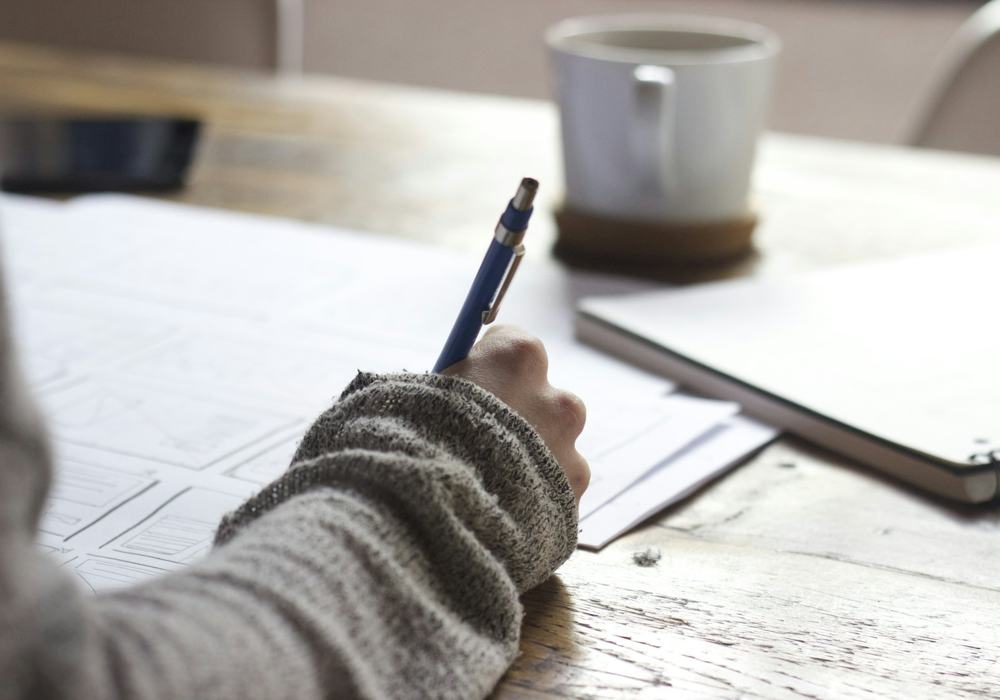 Student writing notes